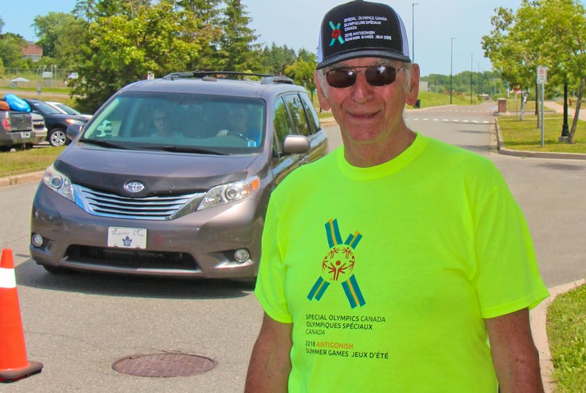 Chuck Gardiner of Antigonish is one of hundreds of volunteers for the Special Olympics Canada 2018 Summer Games already hard at work early Monday afternoon on the St. Francis Xavier University campus in Antigonish.
