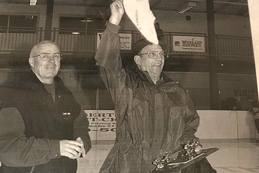 Seen here is a copy of a photo published in the Cape Breton Post on Feb. 13, 1998 when Willie John LeBlanc was presented with a plaque and a Cape Breton Junior B Alpines jacket in honour of his lifelong support of hockey in the area. CAPE BRETON POST