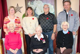 In front, from left, Mary (Mayme) MacSween, Christine Aucoin and Sarah Belle (Sadie) Morrison, all Second World War veterans, in the foyer of Taigh Na Mara long-term care facility in Glace Bay with their children on Oct. 29. The three women, who are all residents of the nursing home, served different roles during the war and were part of the influx of women who joined up after the Canadian government made it legal for them to enlist in 1941. With them are, back row from left, MacSween's daughter, Anne MacDougall; Aucoin's daughter, Patrice MacVicar and son Brian Aucoin;, and Morrison's son, Alex Morrison. NIKKI SULLIVAN/CAPE BRETON POST
