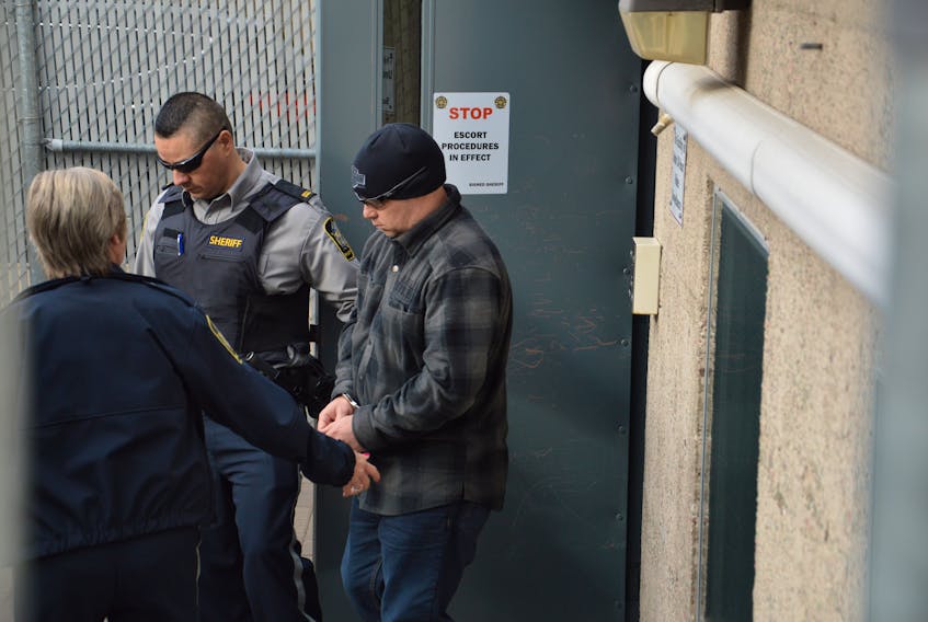 Richard Wayne MacNeil of Gardiner Mines is shown leaving the Sydney Justice Centre in this file photo. MacNeil is accused of murdering his wife last April. CAPE BRETON POST PHOTO