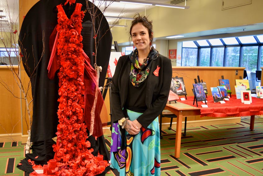 Marlene Powell stand in front of one of her own artworks, done in collaboration with Starla Brown, to remember murdered Indigenous women as well as those affected by violence. This and the other artworks shown above are part of an exhibit called “No More Stolen Sisters” and will run at the Cape Breton University library until Friday during library hours.
ELIZABETH PATTERSON/CAPE BRETON POST