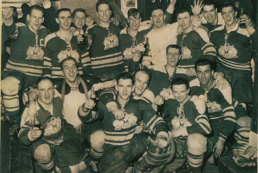 Greg Floyd, bottom centre, celebrates with his Sydney Millionaires teammates after winning the Cape Breton Senior League title in 1957.
