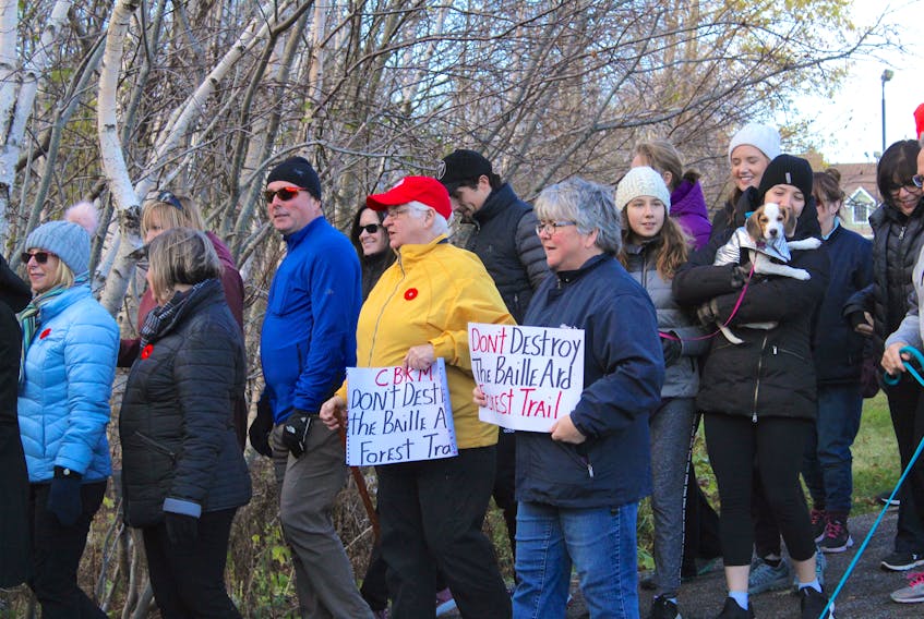 Supporters of the Baille Ard Trail carried signs asking CBRM council not to destroy it as part of their plan to mitigate flooding impacts in the area. ERIN POTTIE/CAPE BRETON POST