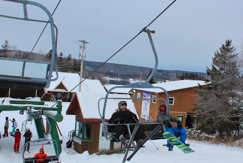 Connor MacDonald and Ausin Leamon ride the chair lift at Ski Ben Eoin on Friday afternoon. They were among many to take in the ski facility in the early part of the new ski season.