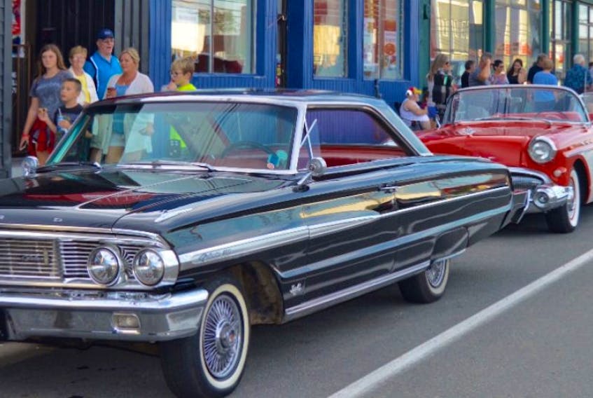 Hundreds of people gather on George Street in Sydney to get a glimpse of their favourite antique and custom vehicles during the annual Hot August Nights event in support of the Children’s Wish Foundation of Canada on Friday.