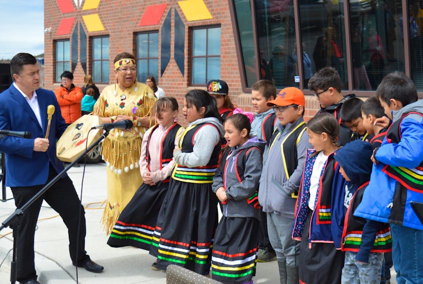 Eskasoni Chief Leroy Denny drums as members of the Mi’kmaq immersion children’s choir perform the honour song during the official opening of the new Mi’kmaw Family and Children’s Services of Nova Scotia in the community May 17.