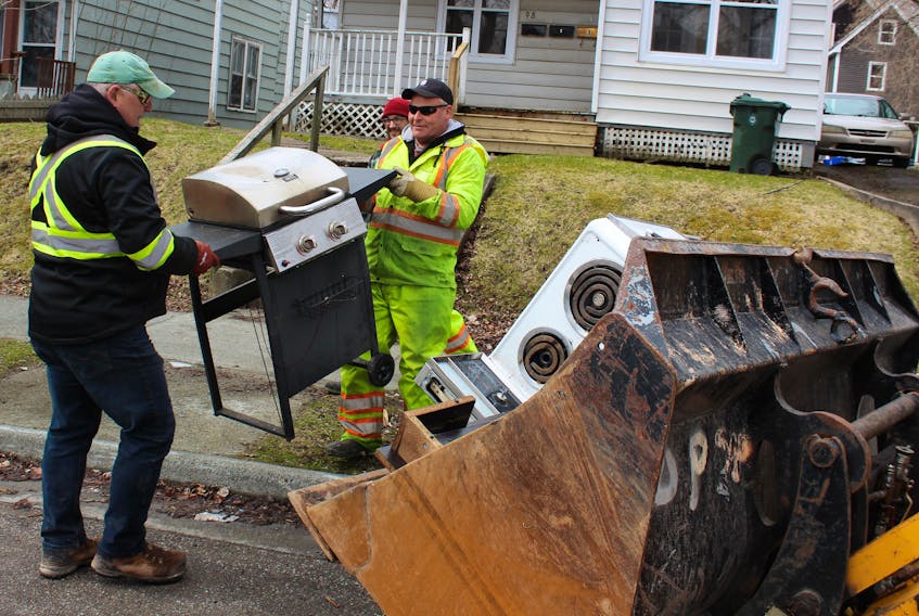 Day 1 of the annual heavy garbage cleanup was held Monday across the Cape Breton Regional Municipality. Crews were dispatched across the municipality to clear items placed at the curb, including Paul Doyle, from left, Kyle Arsenault and Melvin Phillips. The three are members of the AMD crew that was clearing Sydney’s northend.