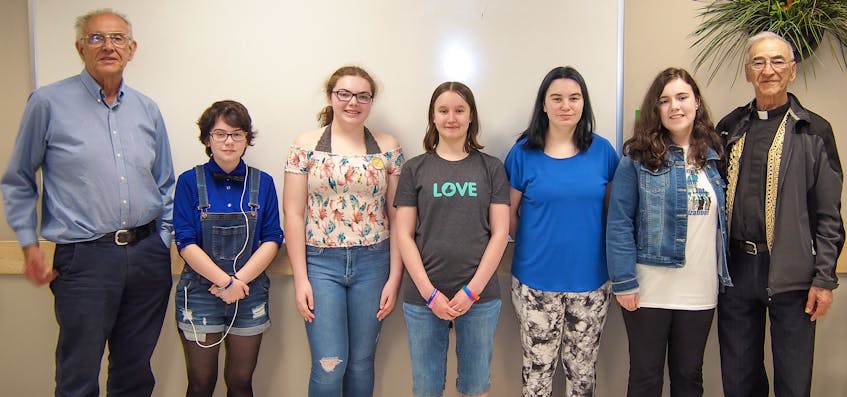 A group of young Cape Breton girls has decided to join the equalization fight with a school project on the subject that led to them contacting the Nova Scotians for Equalization Fairness group and asking if they could get involved in their activities. They have built a website and produced a video about the lack of funding coming to Cape Breton, which can be found at the following link: https://sites.google.com/gnspes.ca/revoltingyouthforequalization/?fbclid=IwAR36xyTX5rDTjj6obEG2v52bTFaudfjZVJ3_339d41Yi39SqvcaLavOuZtk. As well, they have printed buttons, T-shirts as well as info sheets and are now in the process of promoting their efforts on social media. Nova Scotians for Equalization Fairness has vowed to support these girls in every way possible, including pledging financial support to promote their message to the island. Above from left, John R. MacDonald (chairman of Nova Scotians for Equalization Fairness), Micheline Leon, Lauren Chisholm, Mora MacDonald, Sophia Malcolm, Jessica MacDonald and Father Albert Maroun PhD.