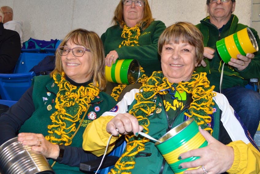 Parents of members of the Northern Ontario curling team cheer the team on with the traditional moose call during the Scotties Tournament of Hearts at Centre 200 in Sydney this week. Shown here in front from the left, Sue Gates and Cloe Lilly, both of Sudbury, and in back, Linda Scharf and her husband Ralph Scharf of Thunder Bay.