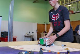 Angus Campbell, 15, of Sydney, works with a Lego robot at the Brilliant Labs workshop at the Nova Scotia Power Makerspace in Sydney. Campbell wants to encourage his peers to try out the tech activities the space has to offer, especially with summer camps starting in July.