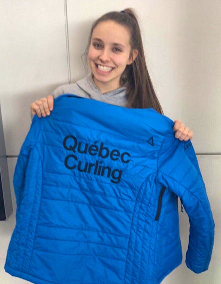 Patricia Boudreault, 20, a member of the Quebec curling team, holds up a teammate’s jacket designed specifically for the Scotties Tournament of Hearts taking place at Centre 200 in Sydney this week. Boudreault says her jacket was stolen while she was out on the town Thursday night.