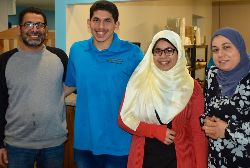 Meet the family behind Sydney’s new Khufu Restaurant and Bakery. From left, former biology teacher Ibrahim Geissa, son Ammar who attends Sydney Academy, daughter Rehaf who is a CBU student, and wife Rehab Elwan. The Egyptian couple also has another son and daughter not pictured.