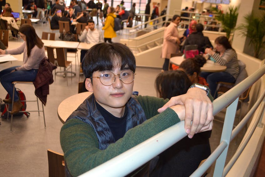 ByeongHee Ko, 22, of South Korea, relaxes in the cafeteria at Cape Breton University. Ko, studying for a bachelor of hospitality and tourism management degree, says one of the biggest culture differences he has noticed is the quieter lifestyle.