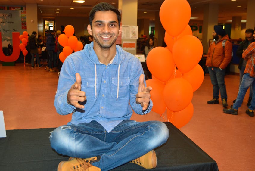 Nirav Patel, 27, from India, studying for his bachelor of business administration (business management) degree at Cape Breton University, has a little fun during a recent multicultural event at the university. Patel said it was the natural beauty of the place that attracted him to Cape Breton.