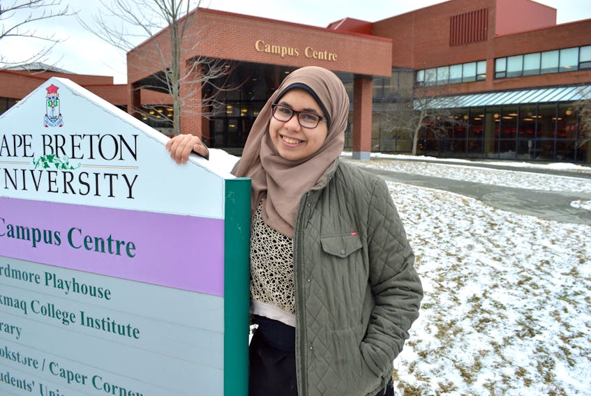 Rahaf Geisa, 19, of Egypt, stands outside Cape Breton University where she is in her second year of her bachelor of science (chemistry) degree. Geisa said her parents came here for a visit and liked it so much they stayed and opened Khufu Bakery and Restaurant in Sydney in December.