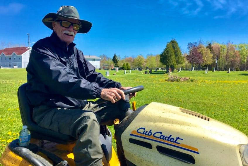 Chuck Porter takes a break from cutting grass on Tuesday. Porter has been cutting the grass as a volunteer at St. Stephen’s Cemetery in Florence for the past number of years. The 79-year-old uses his own sit-on lawn mower and pays for the gas with his own money.