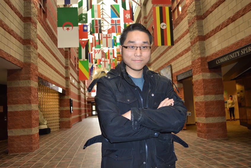 Adam Le Hoan, 22, from Vietnam, stands in the Great Hall at Cape Breton University, which proudly displays the multiculturalism that is in integral part of the university. Le Hoan, who’s studying for a bachelor in degree in hospitality and tourism management, said he enjoys living in Cape Breton and the diversity of the island and university.
