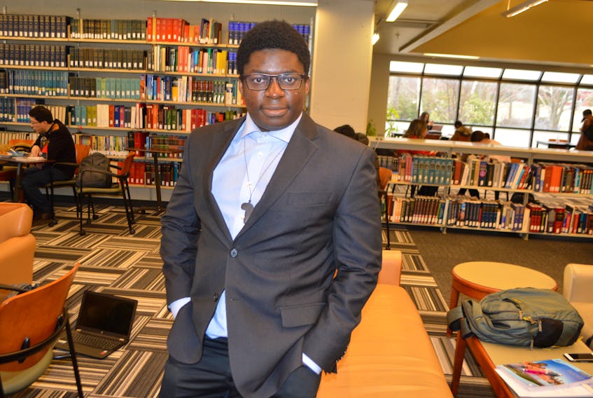 Chitsanzo (Chris) Mkandawire, 22, originally from Malawi, relaxes in the library at Cape Breton University. Mkandawire said he’s not sure what career he will be pursing after university but in the meantime has opened a dance school and plans to stay in Cape Breton.