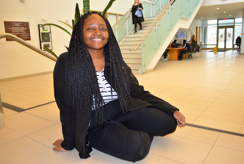 Nancy Mhaza, 22, from Zimbabwe, relaxes between classes at Cape Breton University. Mhaza, working toward her bachelor of hospitality and tourism management degree, said her dream is to open an African restaurant in Cape Breton.