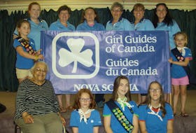 In front from left to right are, Wanda Robson, Morgan Kavanaugh, Shaelyn Murphy and Allie Anderson; standing from left to right are, Carrie Kavanaugh, Freda Potter, D’Anne Francis, Alicia Gordon, Wendy Tobin and Jennifer Hurd. The two girls holding the sign are Cate Power and Lily Hurd. GORDON SAMPSON
