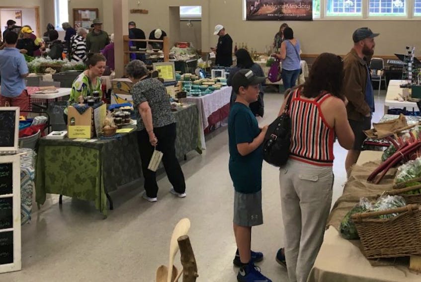 Customers enjoy different kinds of Cape Breton foods and crafts during the Baddeck and Area Community Market that happens every Wednesday from 11 – 2 p.m.