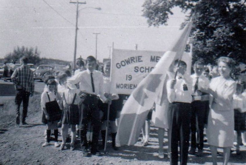 Gowrie School marched in the 1967 Centennial Fair Parade. Teacher Ada Spencer gets the students ready.
