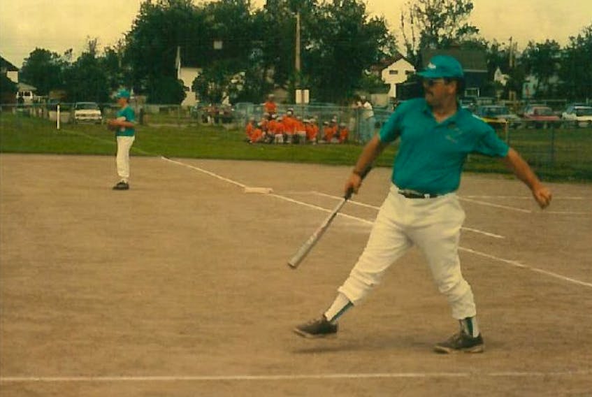 Frank Bursey was known for his passion for baseball. Bursey coached many baseball teams over the years, while also helping to run the local minor baseball association for many years in New Waterford. Bursey is shown hitting ground balls to one of ball teams. 
