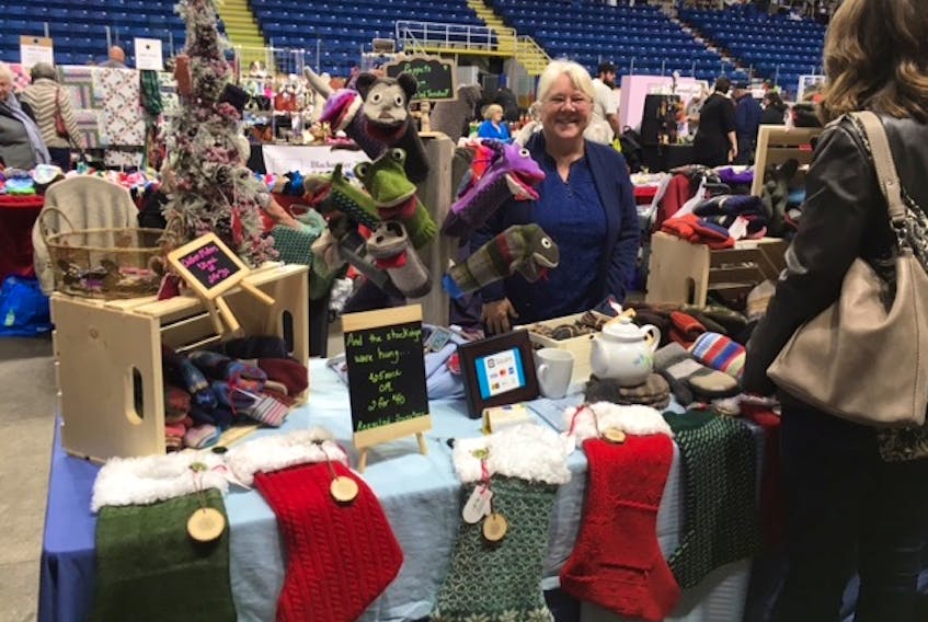 Elaine Shea is shown at her Smitten Mittens and More booth at the Christmas Festival of Crafts at Centre 200.