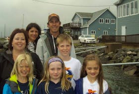 Parents and participants are all smiles as they stand on the jetty with the Northern Yacht Club buildings in the background. From left to right are, front, Claire Phillips, Julia Downey and Poppy Maclean; middle, Janice Downey and Cameron Dunn and back, Rachelle Brown and Levi Phillips.