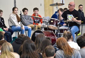 Juno award winning musician Mitch Dorge, drummer with the Crash Test Dummies, shows off his skills during his In Your Face and Interactive presentation at Oceanview Education Centre in Glace Bay on Monday. The presentation is aimed at youth ages 13-18 and focuses on responsible choices.