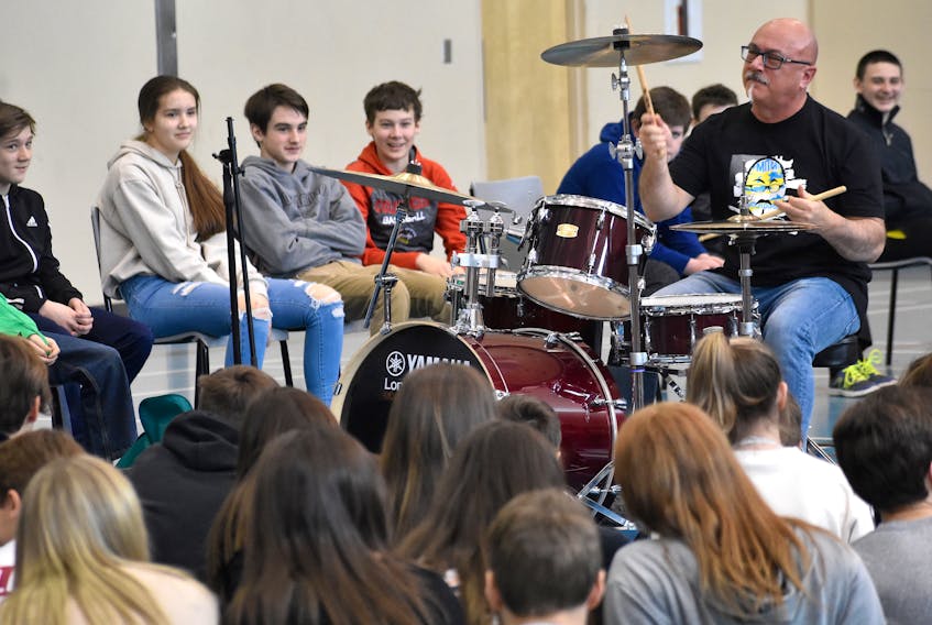 Juno award winning musician Mitch Dorge, drummer with the Crash Test Dummies, shows off his skills during his In Your Face and Interactive presentation at Oceanview Education Centre in Glace Bay on Monday. The presentation is aimed at youth ages 13-18 and focuses on responsible choices.