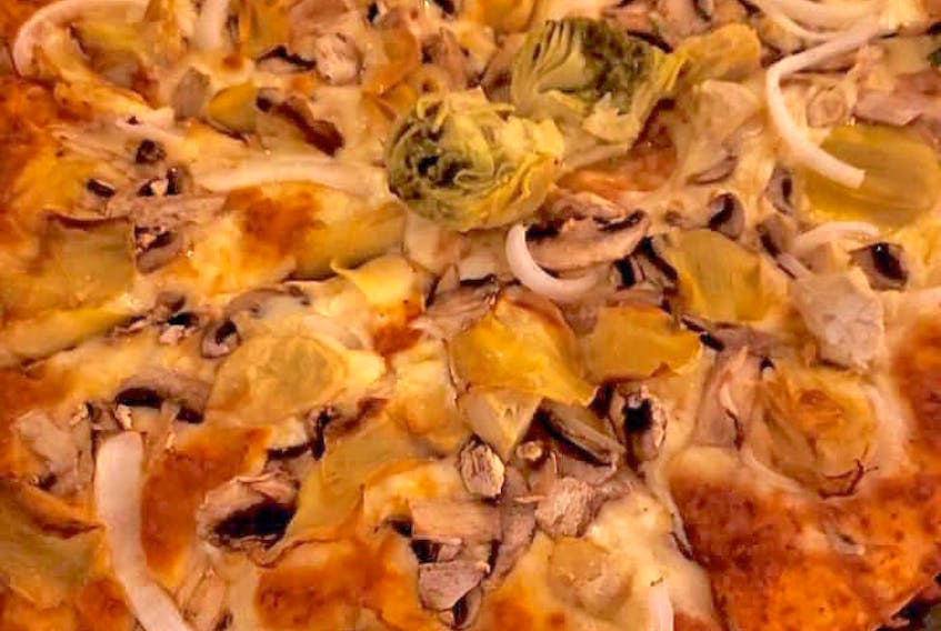 The Good Fellas vegetarian pizza is a hit with Mauricio Horta Diez’s family, friends and employees. It features artichoke, portobello mushrooms, onion and olives