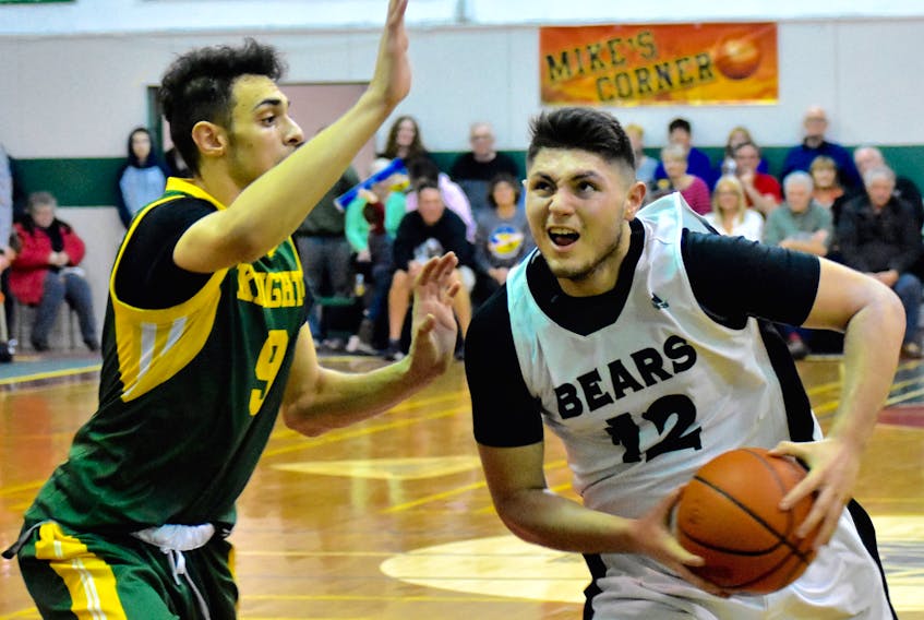 Dylan Messervey, right, of the Breton Education Centre Bears drives the lane against Majd Daqqa of Holy Trinity Northern Knights during the 2018 Coal Bowl Classic. The annual tournament will begin on Monday and runs until Feb. 9 in New Waterford.