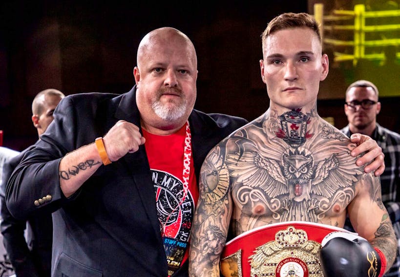 Ryan Rozicki of Sydney Forks, right, is shown with manager Mike Power, originally of New Waterford, after winning the vacant WBA NABA Canadian cruiserweight title in October in Hamilton, Ont. Rozicki and Power will return to Cape Breton for live professional boxing at Centre 200 on Saturday. Photo/Virgil Barrow