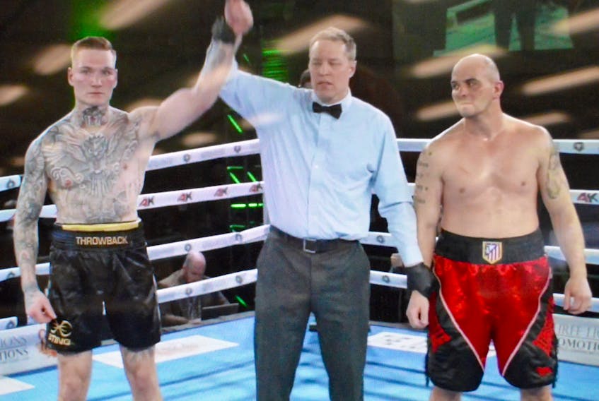 The referee raises of the hand of Ryan Rozicki, left, after the Cape Breton boxer defeated Hungarian Laszlo Penzes at the Hamilton Convention Centre on Saturday evening to improve his professional record to 9-0 (all knockouts). Rozicki knocked his opponent out in the second round after repeatedly knocking him down. The Sydney-based boxer is back in the ring on May 18 when he takes on experienced American fighter Shawn Miller at Centre 200 in Sydney. The All or Nothing event is presented by Three Lions Promotions, the Hamilton-based company that now represents Rozicki. CONTRIBUTED PHOTO/THREE LIONS PROMOTIONS