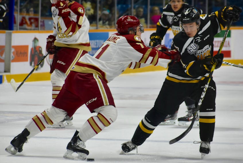 Alex Drover, right, works his way around Alec Rhéaume of the Acadie-Bathurst Titan during Quebec Major Junior Hockey League action on Dec. 7 at Centre 200. The 16-year-old Drover was traded by the Screaming Eagles on Dec. 16 for Nathan Larose and a third-round pick in 2020.