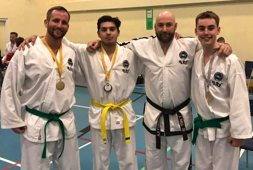 Six members of Integrity Martial Arts in Sydney competed in the Hiltz ITF Taekwondo Open Championship in Waverley, N.S., on April 13. From left are Ryan Yates (adult green belt division, gold in sparring), Rob MacLean (yellow belt division, gold in sparring), Jimmy Hall (black belt division, gold in sparring) and Conner Kennedy (green belt division, double silver medals in sparring and patterns). Missing from the picture is Nevaeh Beever (kids division, bronze in patterns) and Mackenzie Gardiner (green belt division, gold in sparring). CONTRIBUTED PHOTO/JIMMY HALL