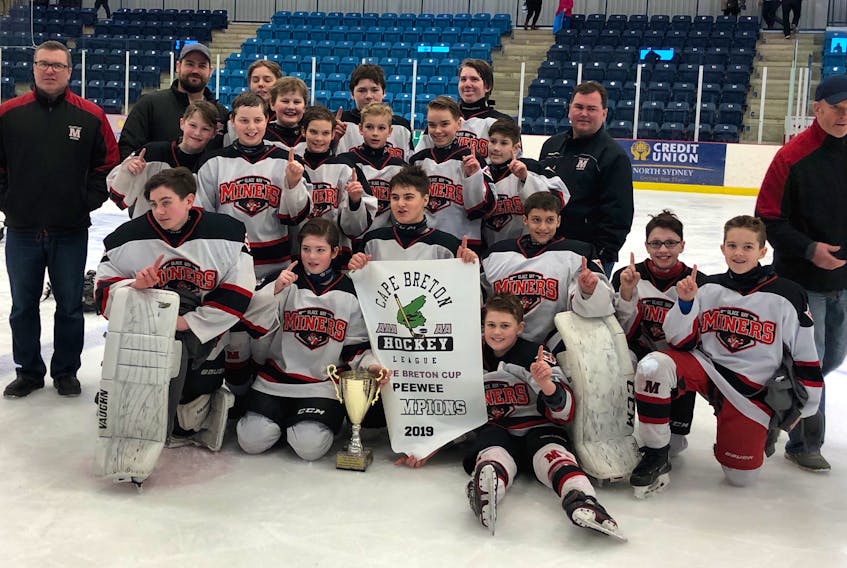 The Glace Bay Miners captured the Cape Breton Peewee 'AAA' Hockey League Cape Breton Cup title, defeating the Sydney Steelers 10-2 in the championship game at the Emera Centre Northside in North Sydney on March 10. The Miners and Steelers will both play in the Nova Scotia provincial championship this weekend in Halifax. The Miners are pictured with the Cape Breton Cup banner. Front row, from left, are Owen Bresson, Garrett MacIntosh, Hudson Clarke, Keegan O'Neill, Manny Strong, Ryland Hanrahan and Kyle Nearing. Middle row, from left, are Luke Sinclair, Pierce Hutchings, Brody O'Handley, Brady Matheson, Rory Pilling and Jesse Cathcarth. Back, from left, are Robbie Sinclair (coach), Tyrone Matheson (manager), Josh Gottwald, Ryan Aucoin, Landon MacIsaac, Billy Cameron, Brian O'Neill (coach) and Bobby O'Handley (coach). Contributed Photo/Brian O'Neill