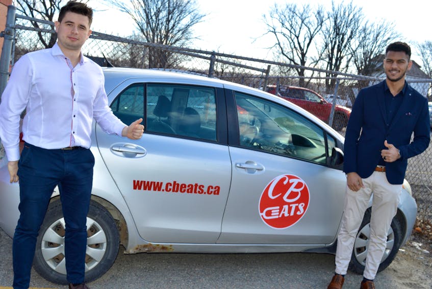 Mykola Kushnir, left, and Nagy Abdou are the students behind CB Eats, a new company that uses technology from another Cape Breton company, Click2Order, to deliver food to Cape Bretoners and supply jobs for Cape Breton university international students.