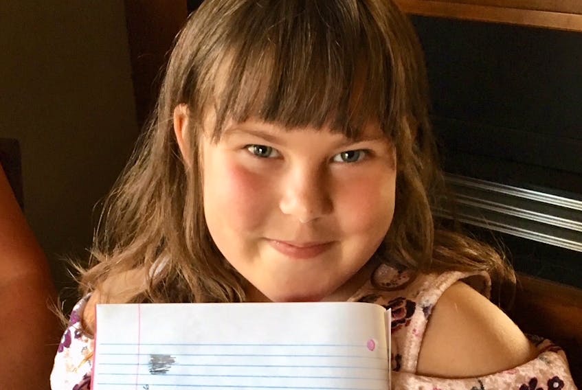 Lexie Stagg, 8, proudly displays her handwriting, which she learned from her mother at home. Newfoundland and Labrador is one of three provinces in which cursive writing is not mandatory in the school curriculum.