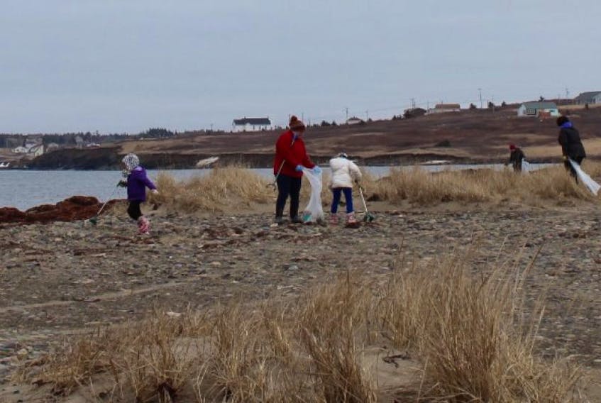 Volunteers clean up at Big Glace Bay Beach for Earth Day in 2015.