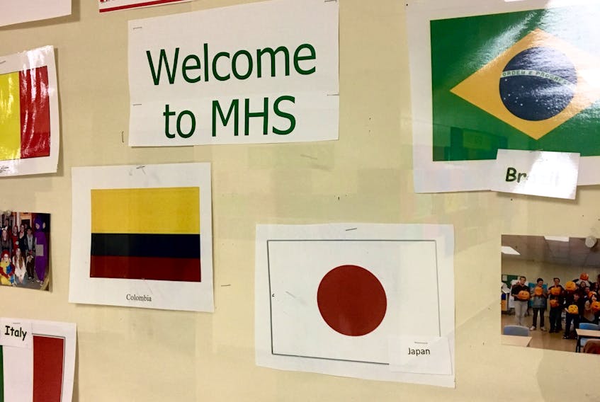 SUBMITTED PHOTO - A bulletin board features several flags to welcome international students.