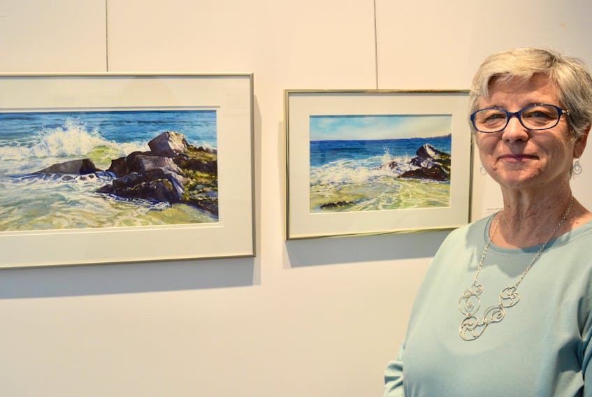 Sydney artist Nancy McLean is shown with some of her work, inspired by Cape Breton beach and coastal area. Her latest exhibit, “Journeys To The Shore,” will be on display in the main gallery at the Cape Breton Centre for Craft and Design until June 13.