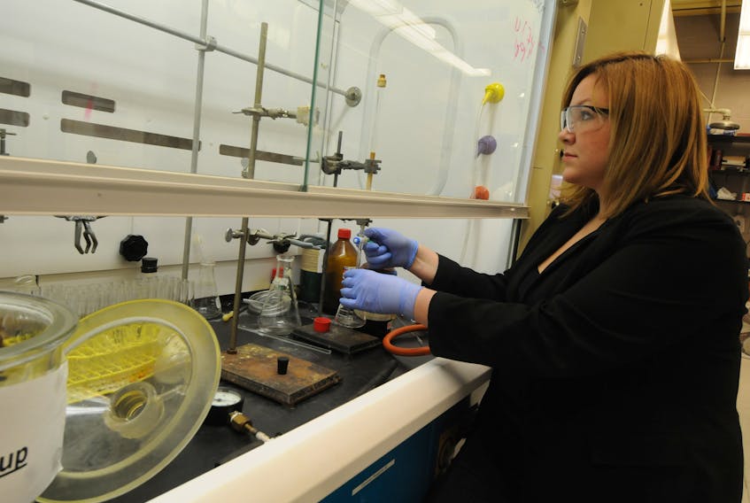 Stephanie MacQuarrie, shown here in a laboratory at Cape Breton University, is an associate professor of organic chemistry at CBU. She is shown here running silica gel column chromatography to separate two organic compounds into their purest forms for further reaction. These compounds are used in the synthesis of highly selective organic catalysts to create important bonding motifs in biologically active molecules.