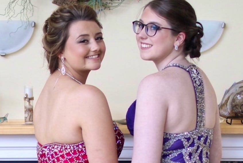 Lena MacDonald, left and Hannah Rudderham, right, got ready to take on Riverview High's prom together on June 25.