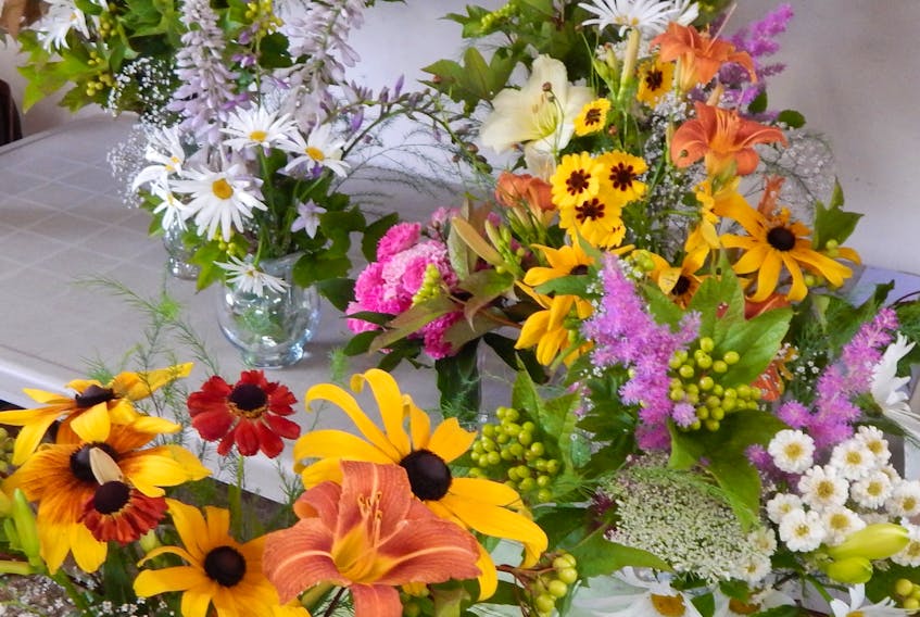Brown-eyed Susans, day lilies, astilbe, feverfew and Queen Anne's lace all offer blooms that work well in bouquets. Caroline Cameron
