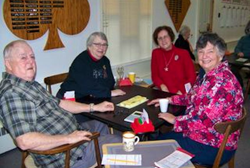 Shown here playing bridge at the Cape Breton Duplicate Bridge Club are, from left to right, Denis Almon, Elaine MacKeigan, Margie Morrison and Margaret Anne Cann.
