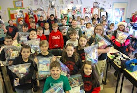 Grade five students at Tompkins Memorial Elementary School in Reserve mines show off the care packages they made for people in need on Dec. 17. Part of a community outreach initiative started by school vice-principal Lee-Ann Burke, who is one of the Grade 5 teachers, students brainstormed ways to help and decided they wanted to help people who are homeless.