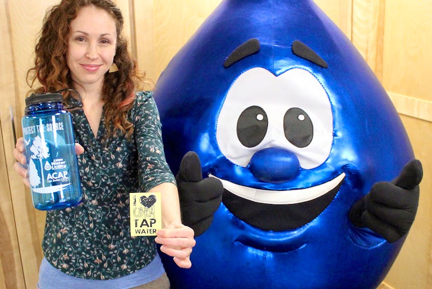 Elizabeth Jessome, a project specialist at ACAP Cape Breton, and Cape Breton Regional Municipality water utility mascot Tappy are seen at ACAP’s office on the Esplanade in Sydney in this 2019 file photo. ACAP Cape Breton and the water utility are hosting a poetry contest that encourages residents to explore the watersheds that supply our tap water, then write a poem. Chris Connors/Cape Breton Post

