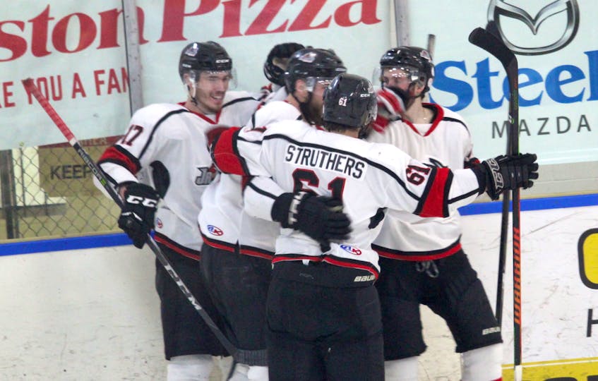 The Kameron Junior Miners celebrate after scoring against the East Hants Penguins in Nova Scotia Junior Hockey League championship series play Saturday in Lantz. The Junior Miners are up 2-0 in the best-of-seven series.